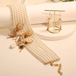 Elegant multi-layer pearl choker necklace and tassel earring set with golden accents