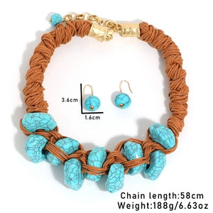 Macro detail of handmade bohemian woven necklace with turquoise stones and size markings