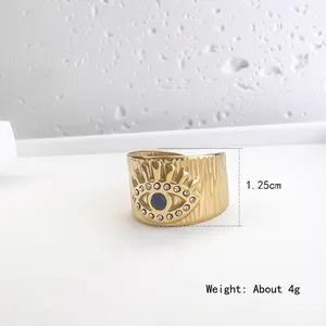 Bague oeil maléfique en acier doré 18K avec zircon bleu et texture rétro ciselée