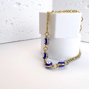 Bohemian gold plated Figaro chain bracelet with five blue enamel evil eye beads