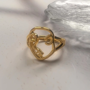 Minimalist stainless steel open ring with abstract face portrait design in gold finish