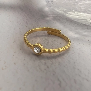Minimalist gold plated adjustable ring with beaded texture and small round zircon
