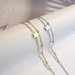 Double-layered stainless steel star bracelet with 18k gold plating and elegant light shadows