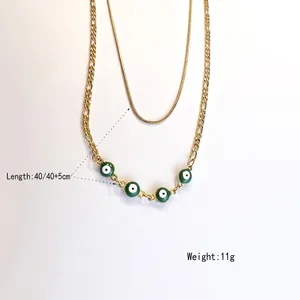 Double-layered stainless steel evil eye necklace with gold plating and green charms