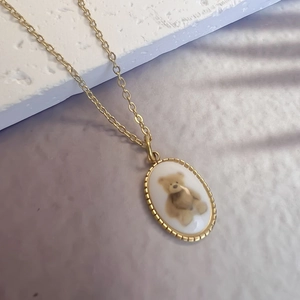 French vintage 18K gold plated necklace with oval bear pendant and fine link chain