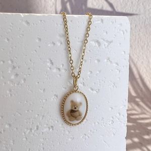 18K gold plated necklace featuring an oval pendant with a 3D teddy bear design
