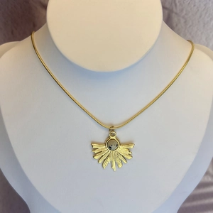 Golden fan pendant necklace with natural dalmatian jasper stone on snake chain