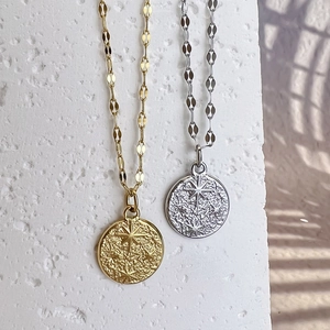 French vintage hammered star coin necklace in gold and silver finish with embossed sunburst