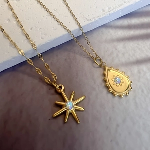 Gold stainless steel star and teardrop opal pendant necklaces with layered chain design