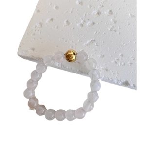 Minimalist beaded ring with natural white quartz stones and a central gold metal bead accent