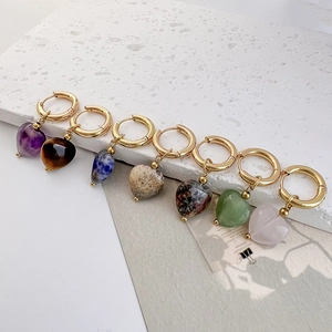 Set of seven heart-shaped natural stone earrings with polished gold metal hoops