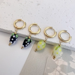 Chic stainless steel hoop earrings with colorful glass strawberry charms in blue and yellow