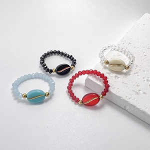 Elegant beaded elastic rings set with coffee bean charms in four stylish colors