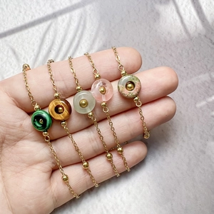 Gold titanium steel bracelets featuring natural stone beads and small gold beads