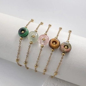 Set of five gold titanium steel bracelets with colorful natural stone donut charms