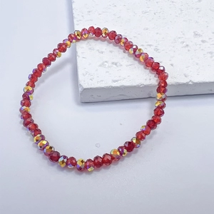Macro view of red faceted crystal beads with iridescent AB coating on an elastic bracelet