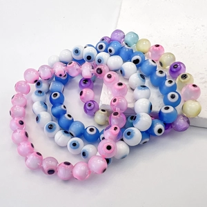 Colorful Evil Eye glass bead elastic bracelets in various bright pastel colors