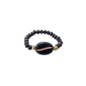 Elegant beaded coffee bean ring featuring black faceted beads and golden accents on white background