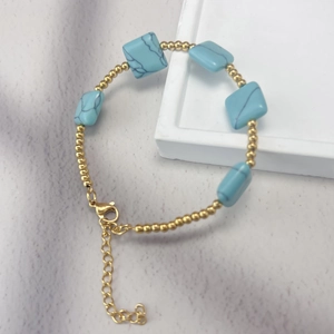 Bohemian stainless steel beaded bracelet featuring blue natural stones and adjustable chain