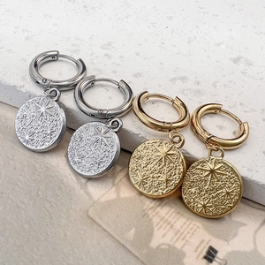 Golden and silver titanium steel hoop earrings with 18K gold star and starfish pendants