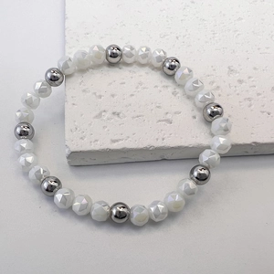 Close-up of beaded bracelet with white faceted beads and polished silver steel balls