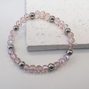 Close-up of 6mm pink faceted crystal beads and silver steel spheres on stretch bracelet