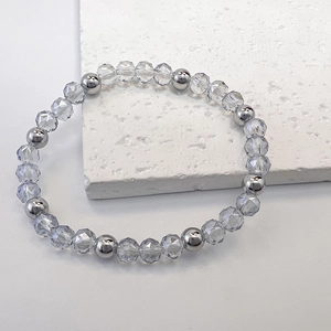 Detailed close-up of 6mm clear crystal and silver metal beaded elastic stretch bracelet