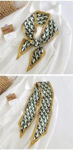 Détail d'un foulard étroit en soie à motif pied-de-poule vert avec bordure jaune