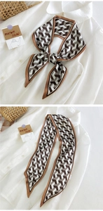 Détail d'un foulard Twilly à motif géométrique zigzag et finition en soie brillante