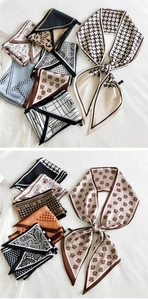 Detail showing assorted silky scarves with paisley, houndstooth and geometric prints