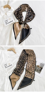 Detail of elegant leopard print neck scarf with HILLDI lettering and modern patchwork design