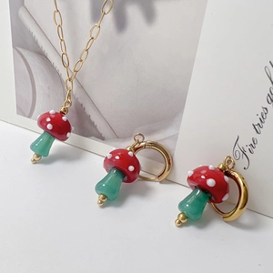 Colorful mushroom pendant necklace and earring set with red and green enamel accents
