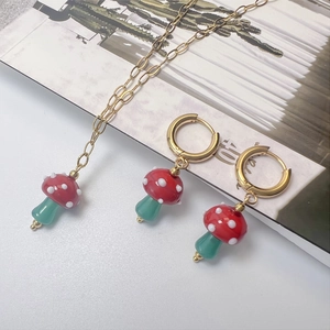 Chic mushroom pendant jewelry set with red polka dot necklace and matching earrings