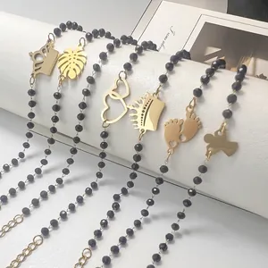 Bohemian black bead bracelet with gold stainless steel charms like crown and angel pendant