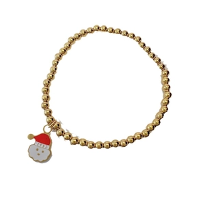 Golden stainless steel beaded stretch bracelet featuring a colorful Santa Claus charm
