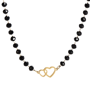 Minimalist necklace with black glass beads and interlocking gold heart pendant on white