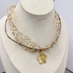 Sexy leopard print scarf necklace featuring a gold flower pendant with zircon stone
