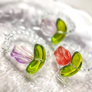 Three-piece set of tulip beaded rings in purple, orange, and pink crystal colors