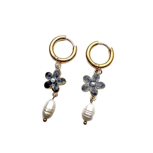 Elegant gold earrings with blue enamel flower and baroque pearl drop charms