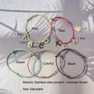 Adjustable DIY woven bracelet with stainless steel initial charms in five vibrant colors