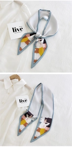Detail of slim silk scarf with fashion illustration and blue border on white background