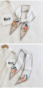 Close-up of elegant cream twilly silk scarf featuring artistic illustration for handbags