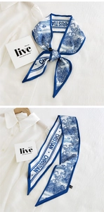 Detail of blue floral Toile de Jouy print on a white narrow polyester scarf for women
