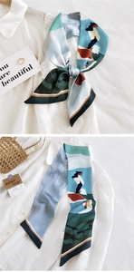 Détail d'un foulard en soie à motif cartoon avec texte 'as you wish' sur chemise