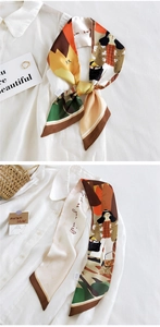 Détail d'un foulard en soie coloré à motifs gribouillis sur une chemise blanche chic