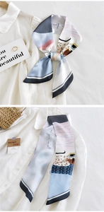 Détail d'un foulard en soie imprimé avec texte 'as you wish' et motifs floraux abstraits