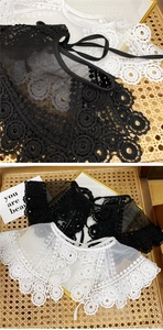 Close-up of retro lace hollow collar showing intricate mesh details and ribbons