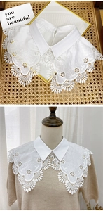 Detail of white floral embroidery on a lace false collar for women's sweaters