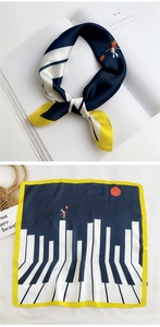 Detail of artistic square scarf featuring piano keys and rabbit print on a straw bag