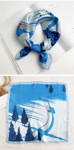 Detail of square silk scarf showing snowy winter forest print with a red train design